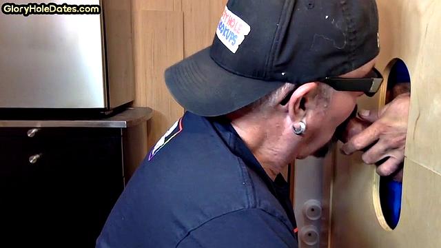 Gloryhole gay enjoys jerking while sucking big dick