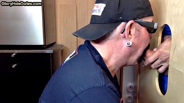 Gloryhole gay enjoys jerking while sucking big dick