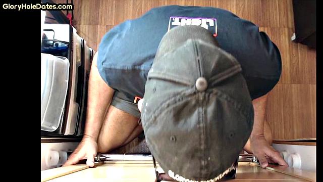 Gloryhole gay enjoys jerking while sucking big dick