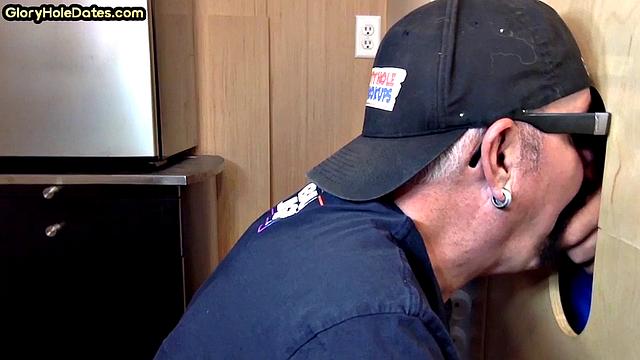 Gloryhole gay enjoys jerking while sucking big dick