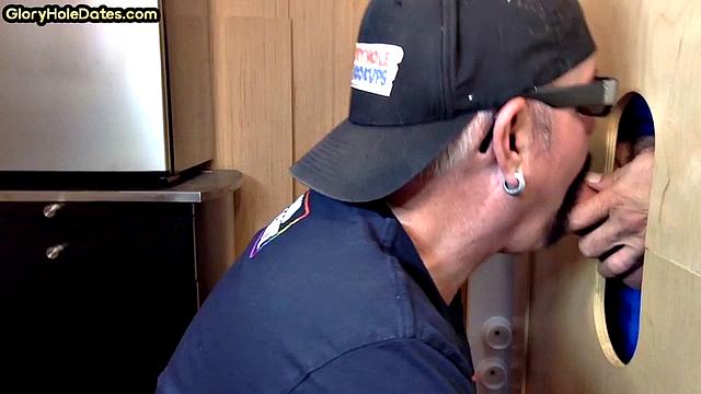 Gloryhole gay enjoys jerking while sucking big dick