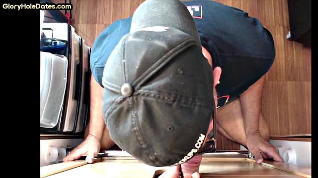 Gloryhole gay enjoys jerking while sucking big dick