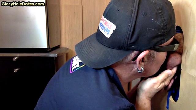 Gloryhole gay enjoys jerking while sucking big dick