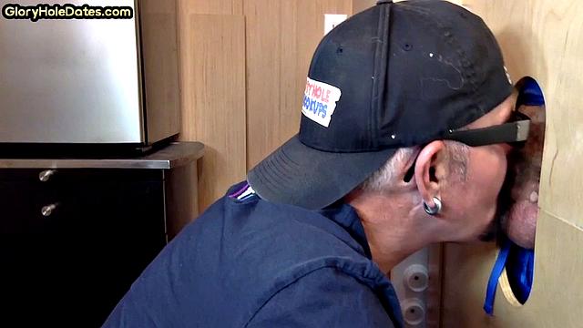 Gloryhole gay enjoys jerking while sucking big dick