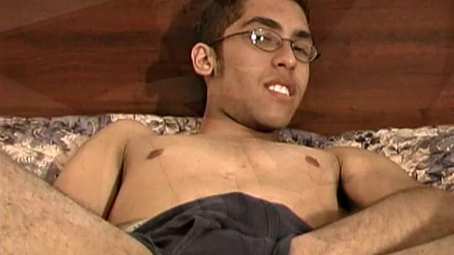 This skinny 19 year old boy has a nasty mouth as he hops on the bed for a solo jerk off. Zander Lee fingers his asshole, strokes his cock, and pumps out a load onto his belly.