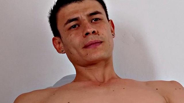 Skinny and smooth Dominic strips to his underwear and hops on a bed. There, he works up a stiff one and then removes his boxers. Kicked back on the bed, the young Latino starts masturbating.