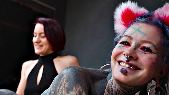 Pet Play dominatrix controls Tattoo cat-girl