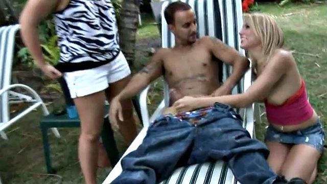 Small dick mistresses wank submissive in outdoor threeway