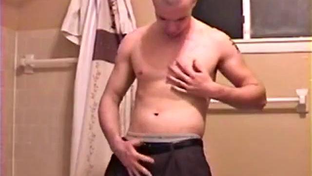 After a busy day Shawn is in the bathroom getting ready to shower and decides to play with himself through his pants. He strips and flexes for the camera, while stroking his hard cock, and soon Shawn blasts a warm cum load onto his chest.