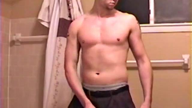 After a busy day Shawn is in the bathroom getting ready to shower and decides to play with himself through his pants. He strips and flexes for the camera, while stroking his hard cock, and soon Shawn blasts a warm cum load onto his chest.