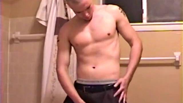 After a busy day Shawn is in the bathroom getting ready to shower and decides to play with himself through his pants. He strips and flexes for the camera, while stroking his hard cock, and soon Shawn blasts a warm cum load onto his chest.