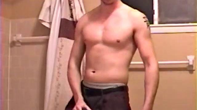 After a busy day Shawn is in the bathroom getting ready to shower and decides to play with himself through his pants. He strips and flexes for the camera, while stroking his hard cock, and soon Shawn blasts a warm cum load onto his chest.