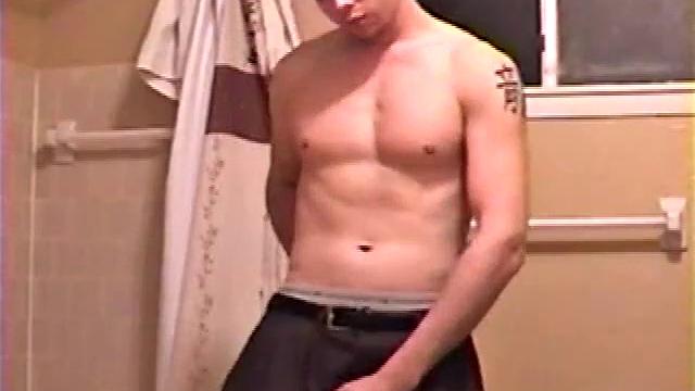 After a busy day Shawn is in the bathroom getting ready to shower and decides to play with himself through his pants. He strips and flexes for the camera, while stroking his hard cock, and soon Shawn blasts a warm cum load onto his chest.