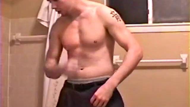 After a busy day Shawn is in the bathroom getting ready to shower and decides to play with himself through his pants. He strips and flexes for the camera, while stroking his hard cock, and soon Shawn blasts a warm cum load onto his chest.
