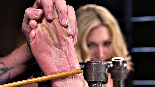 BDSM sub endures feet whipping and pussytoying by master