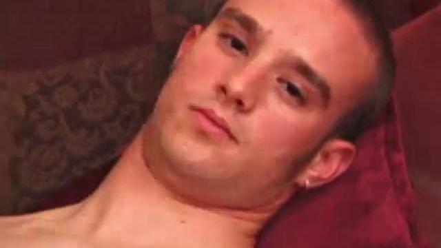 Ethan strips naked and strokes up a boner, while watching porn. After lubing up his ass, he fingers himself and then inserts a dildo. Ethan gives his hole a good workout and shoots a huge nut onto his chest.