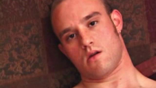 Ethan strips naked and strokes up a boner, while watching porn. After lubing up his ass, he fingers himself and then inserts a dildo. Ethan gives his hole a good workout and shoots a huge nut onto his chest.