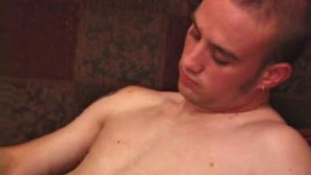 Ethan strips naked and strokes up a boner, while watching porn. After lubing up his ass, he fingers himself and then inserts a dildo. Ethan gives his hole a good workout and shoots a huge nut onto his chest.