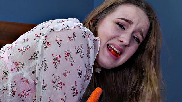 Kinky brown-haired chick takes a carrot in her ass while wearing a mask