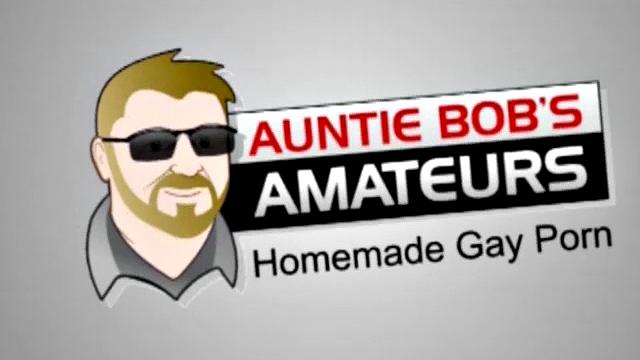 In this scene, Mike is naked, half hard and sitting on the sofa watching a video. Auntie Bob has the camera on a tripod, freeing him to move in, lube up Mike's cock and give him a hand job.