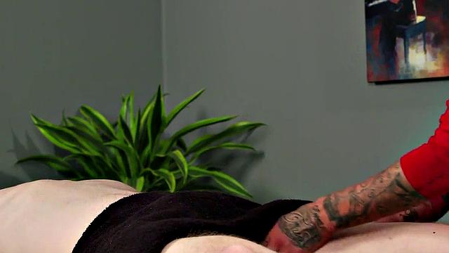 CFNM college masseuse gives oiled HJ to her client