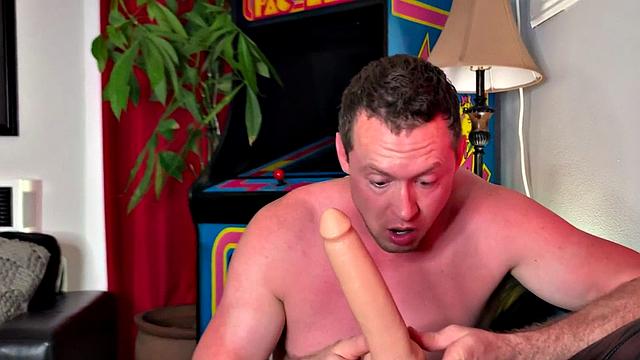 Foot fetish hunk toys his ass with dildo in solo action