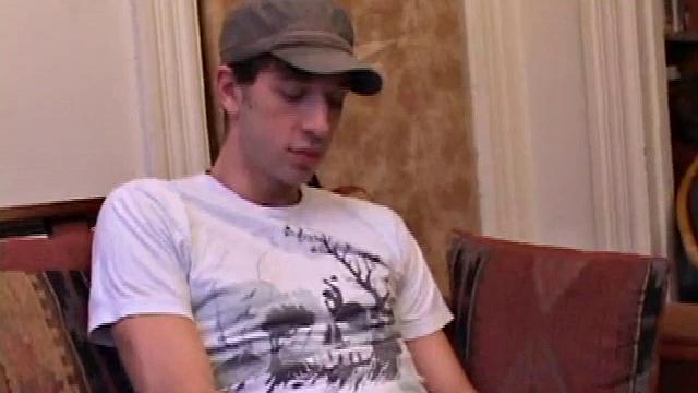 While watching a porn video, Gabriel Turner gets himself hard and then lubes his stiff dick for self-pleasuring.