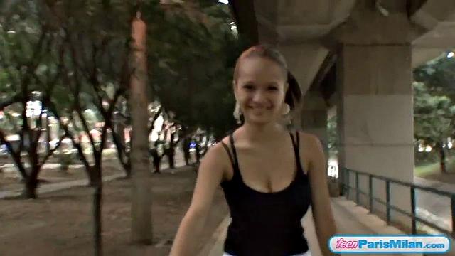 Busty teen riding her bike through the park