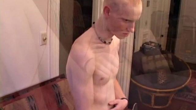 Bummed out by a broken skateboard, Kaos pulls out his lube and pops in a porn video. After stripping naked, he strokes his huge cock and spews a warm cum load onto his chest.