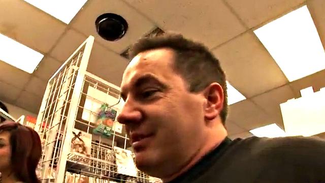 Watch this pierced MILF smile as she rides hard and gives a handjob to her man