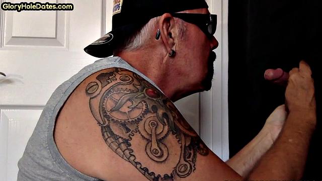 Tattooed gloryhole mature sucks cock in amateur BJ