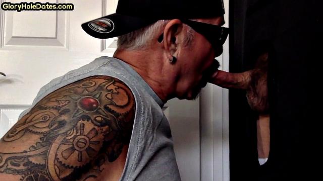 Tattooed gloryhole mature sucks cock in amateur BJ