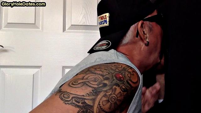 Tattooed gloryhole mature sucks cock in amateur BJ