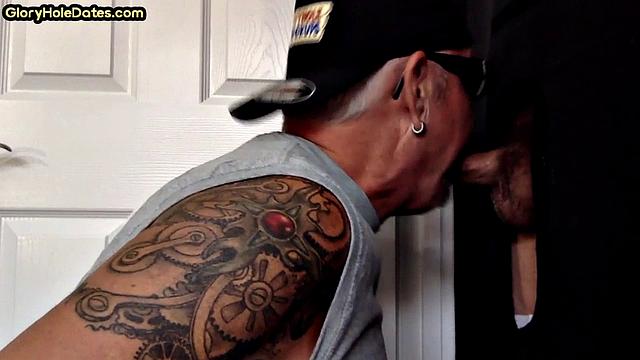 Tattooed gloryhole mature sucks cock in amateur BJ