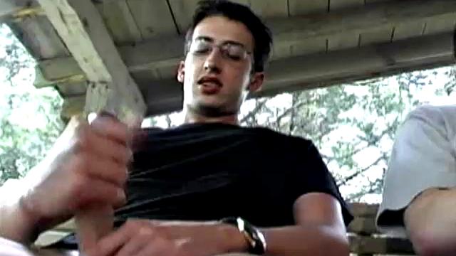 In this hot dual jerk off scene, Chris Cortez and Brayden Knight challenge each other to a jack off contest. The one who cums first is the winner. Seated side-by-side on a swinging love seat, the two whip out their dicks and go to work.