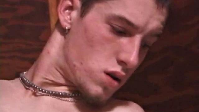 Adam thumbs through a porn magazine, hardens up, uses dildo, shows ambidextrous talents, strokes.