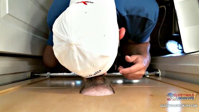 Random guy spots the gloryhole and figures why not try his luck with a stranger's cock