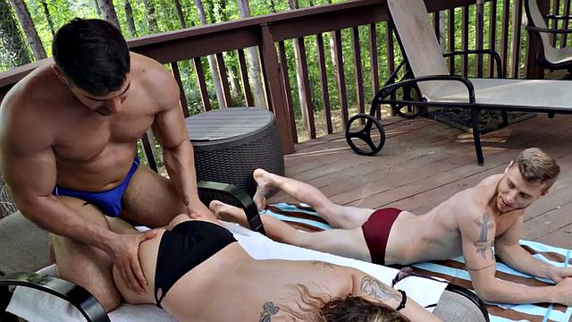 Bisexual tattooed babe licked and fucked outdoors in 3some