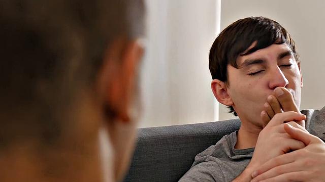 Twinks Martin and James kiss on sofa, toes sucked. Boys undress for more toe sucking, then naked. Martin sucks James.