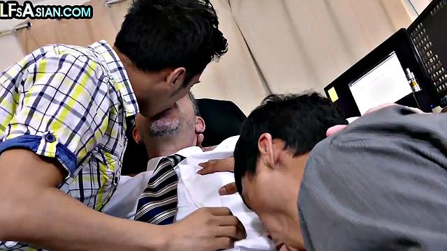 Gay businessman fucks Asian twinks in office 3some