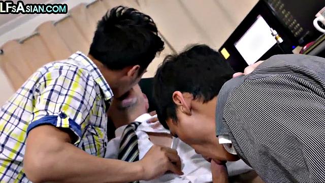 Gay businessman fucks Asian twinks in office 3some
