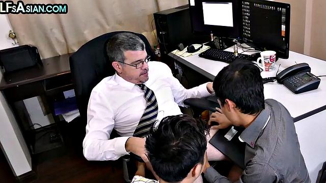 Gay businessman fucks Asian twinks in office 3some