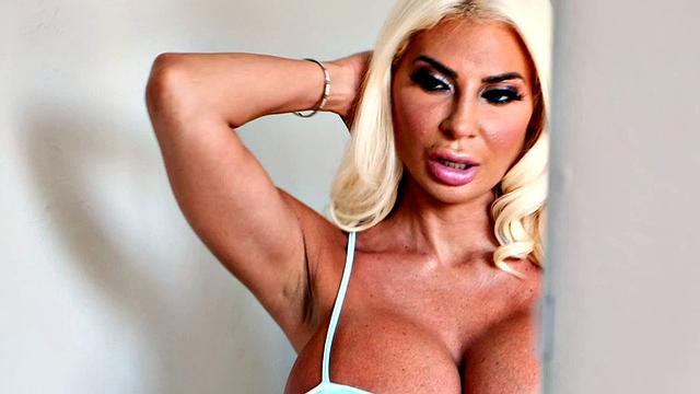 A huge-titted cougar and toy