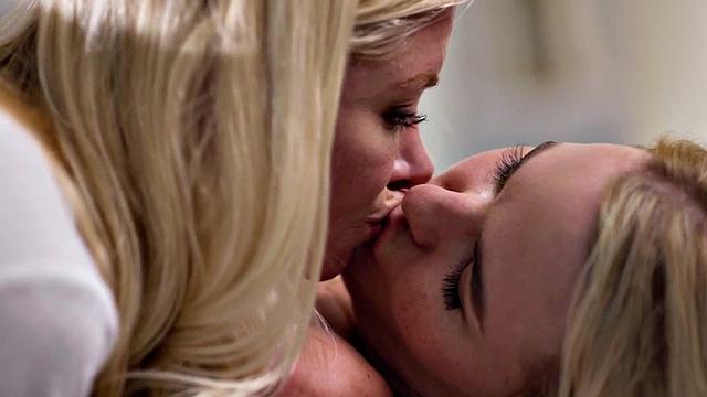 Massaging lesbians play in threesome with pussies