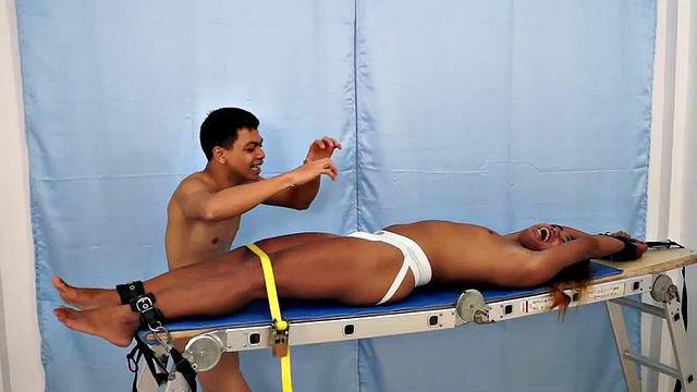 We strapped Hunter down on our tickling rack and released our sadistic ticklers Argie and Vahn on him. First was Argie.