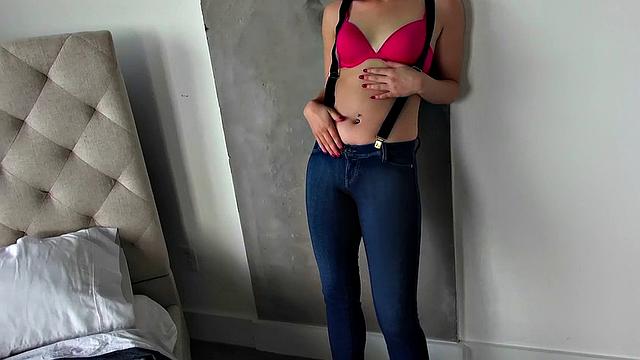 Petite babe in bra and panties gives a hot solo handjob in the bedroom