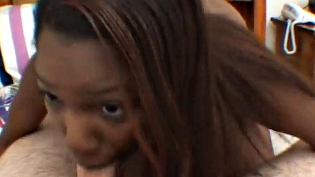 Ebony teen deepthroats hard white cock