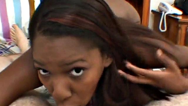 Ebony teen deepthroats hard white cock