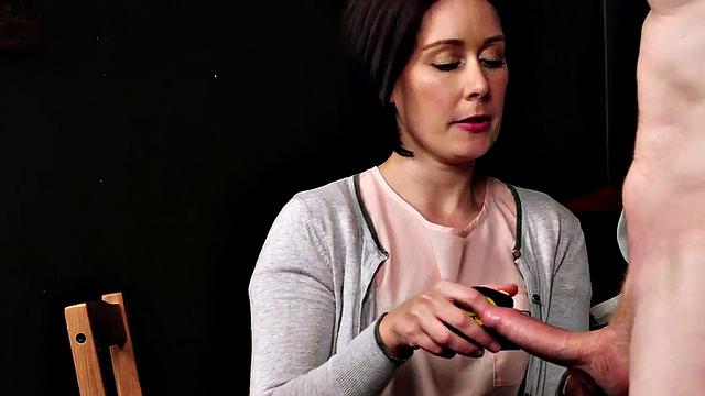 A British MILF in high heels and stockings give a hot handjob and blowjob in a CFNM scene