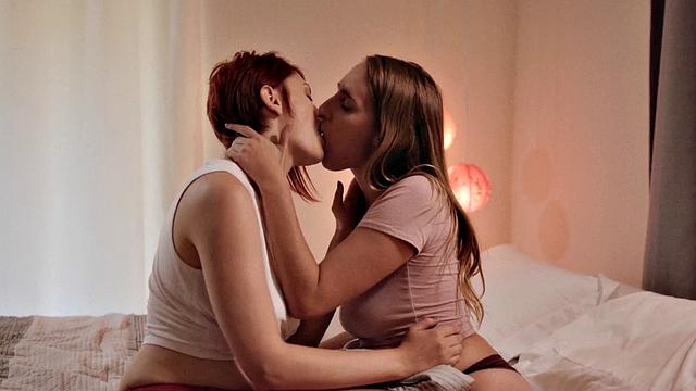 Redhead bootylicious lesbian seduced by 19yo lez